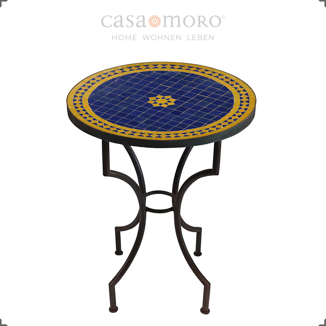 Mosaic table as a dining table for two with a star-shaped zellige pattern in blue and yellow