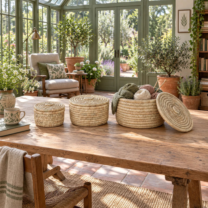 Three palm-leaf baskets in the sunroom, the largest one containing knitting supplies: 3.5 liters, 7 liters, and 15 liters in volume.