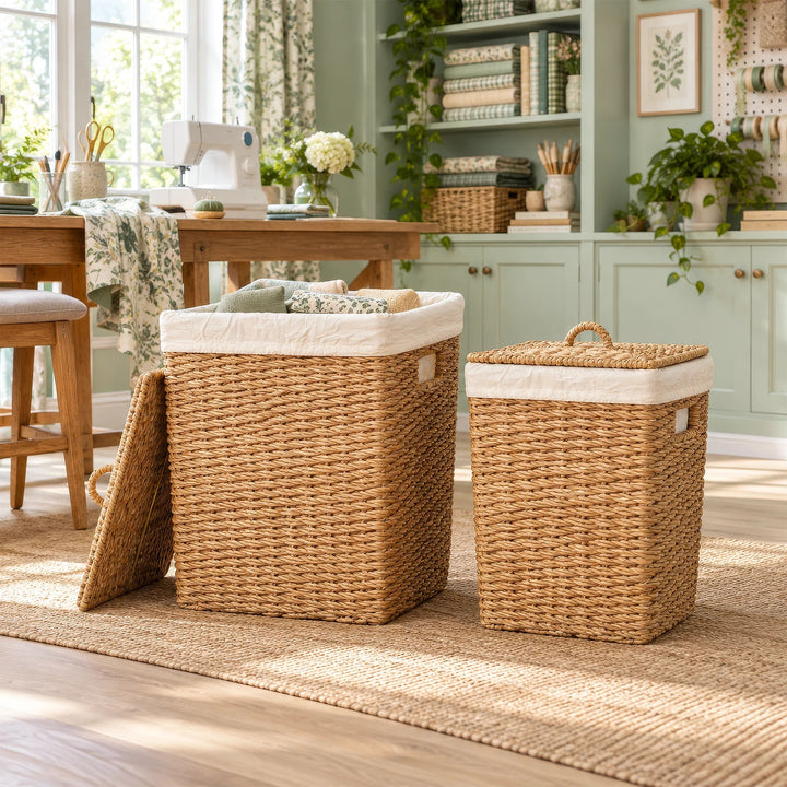 Two seagrass storage baskets with lids, with capacities of 50 and 90 liters, in the sewing room; a large basket filled with fabrics.