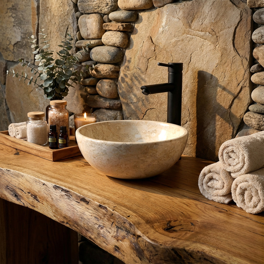 Light stone washbasin as an attachment on a solid wooden console with black fittings in a natural spa bathroom ambience