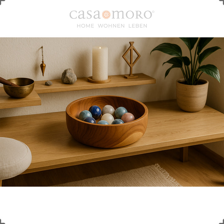 Natural decorative bowl made of solid teak wood with a soft grain