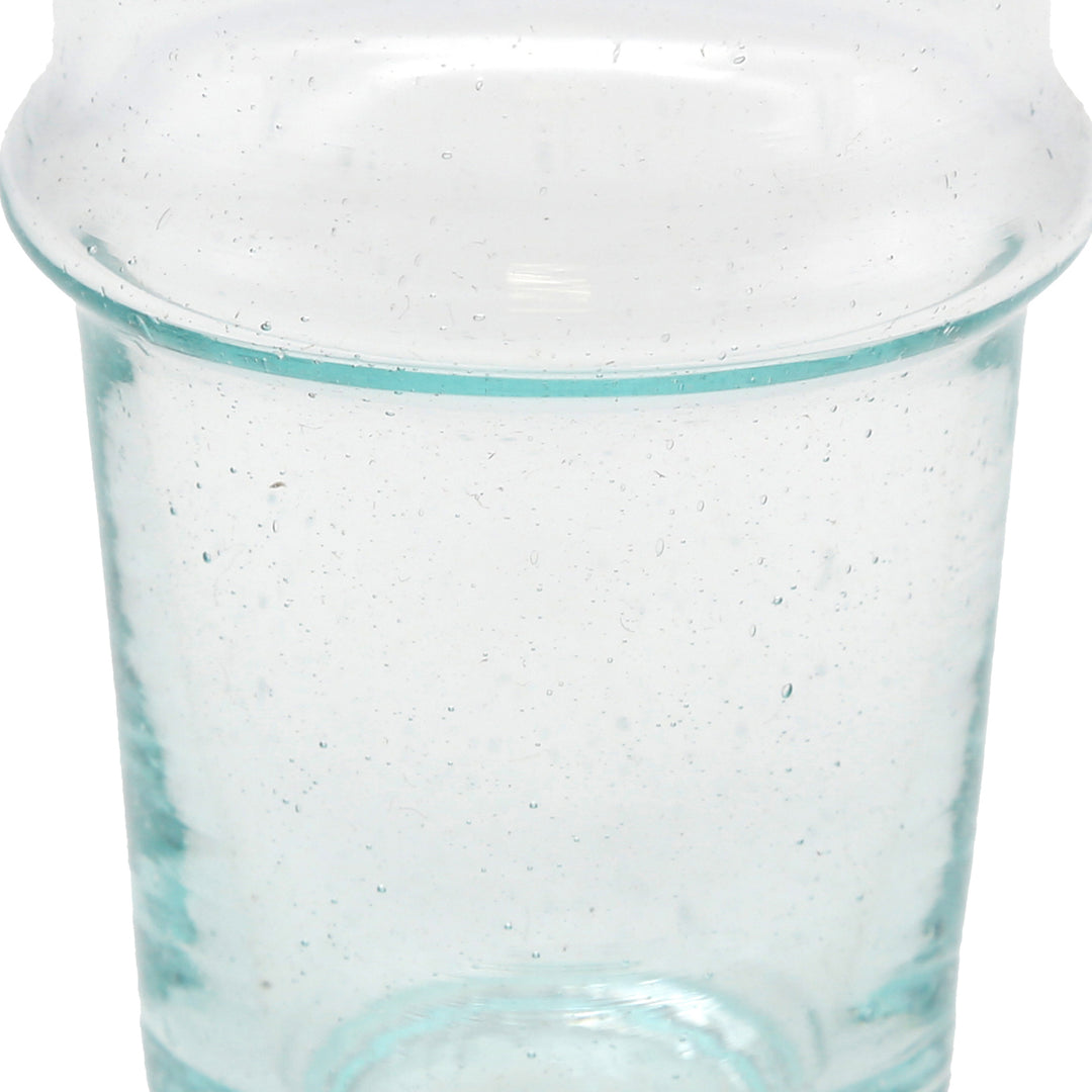 Iced coffee in a transparent glass - handcrafted surface with structure