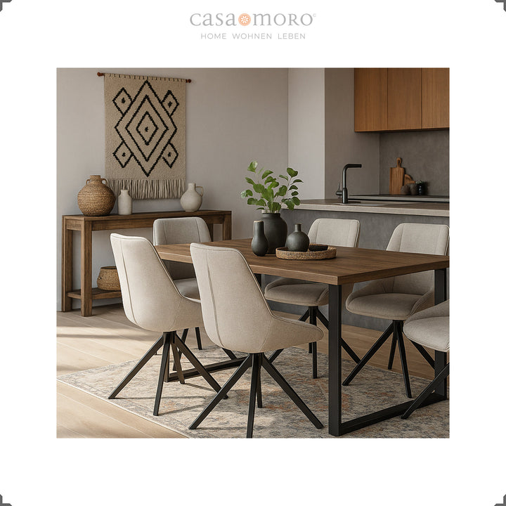 Dining room with six 360° rotating upholstered chairs in light gray and black metal frame - harmonious living ambience with wooden table, carpet and wall decoration
