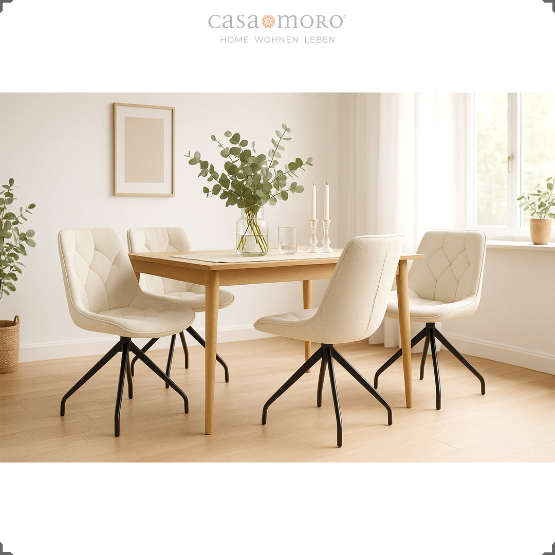 Set of 4 upholstered chairs that can be rotated 360° in beige with a black metal frame - bright dining room with wooden table, eucalyptus decoration and natural lighting