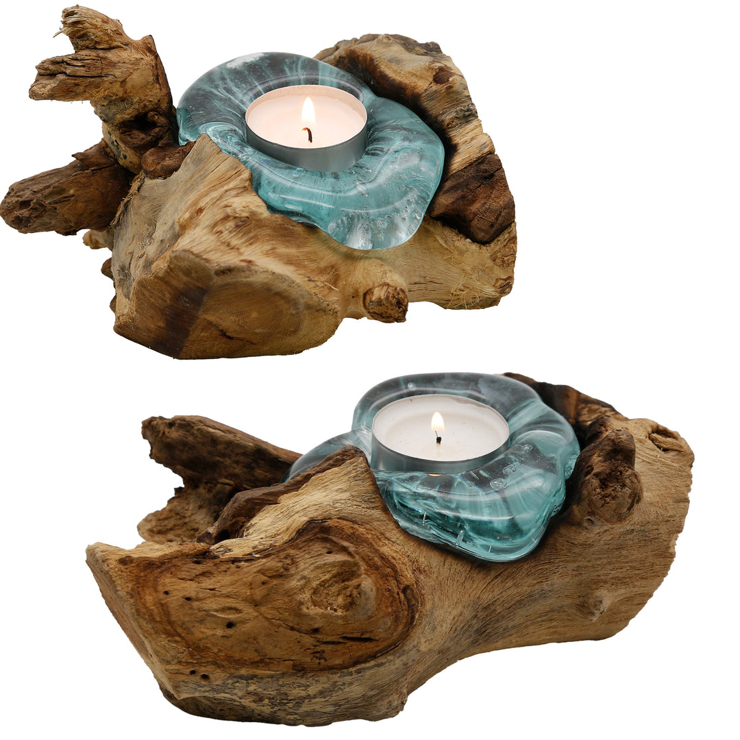 Two variants of the tea light holder made of glass and root wood, each with a unique shape and warm glowing tea light.