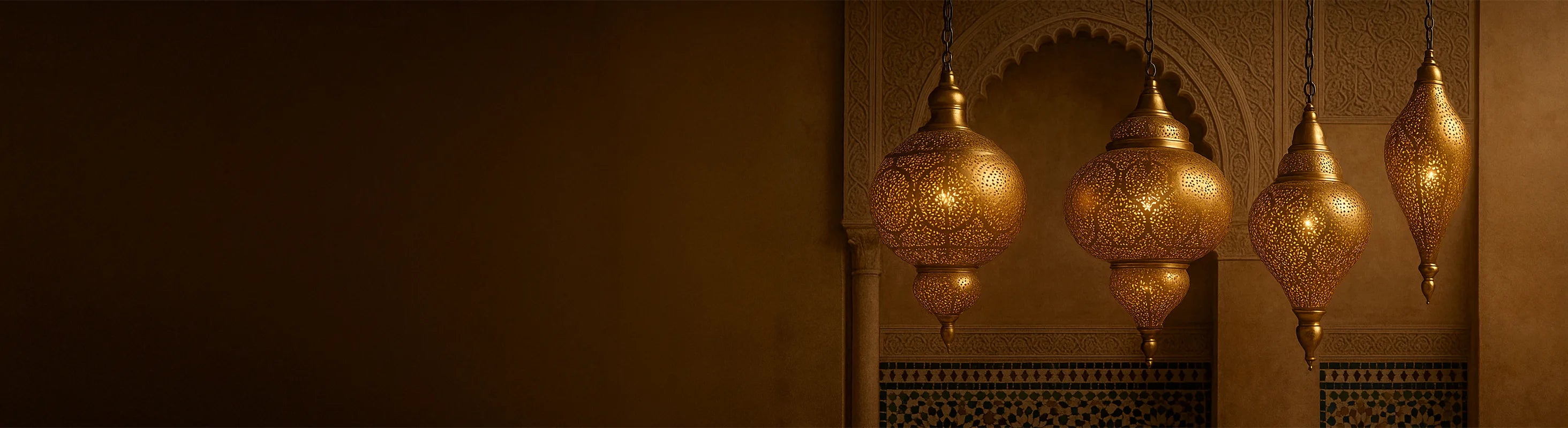 Oriental brass ceiling lamps – Oriental brass ceiling lamps hang in front of ornate arches and mosaic walls in a Moroccan interior.