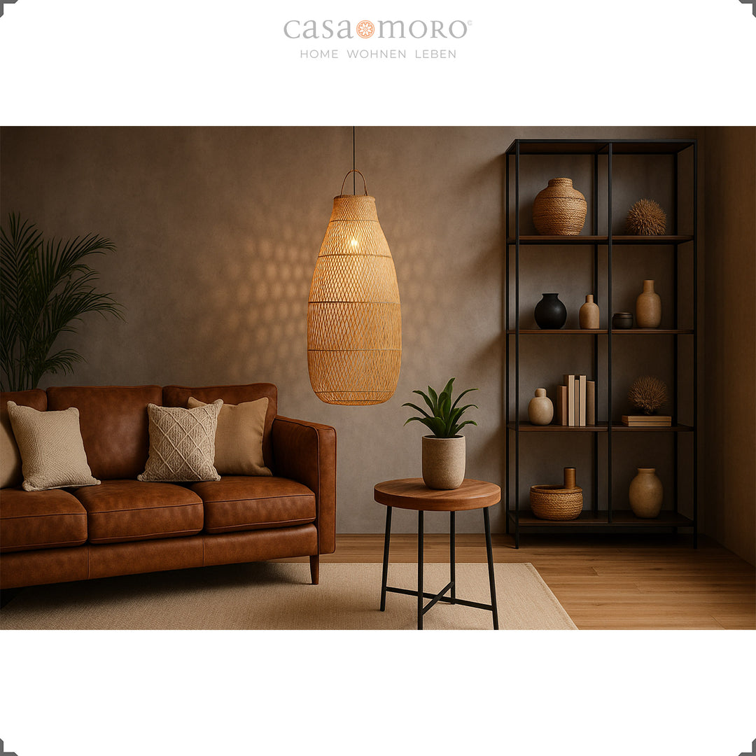 Large rattan lamp in the living room with leather sofa and warm light for a cozy atmosphere