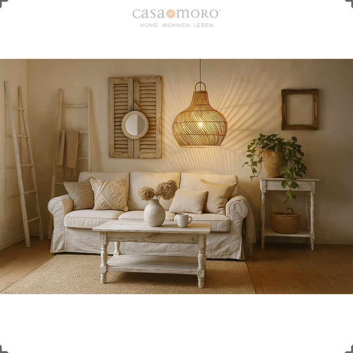 Handmade rattan lamp as a hanging lamp in the living room, creates warm light and a cozy boho atmosphere