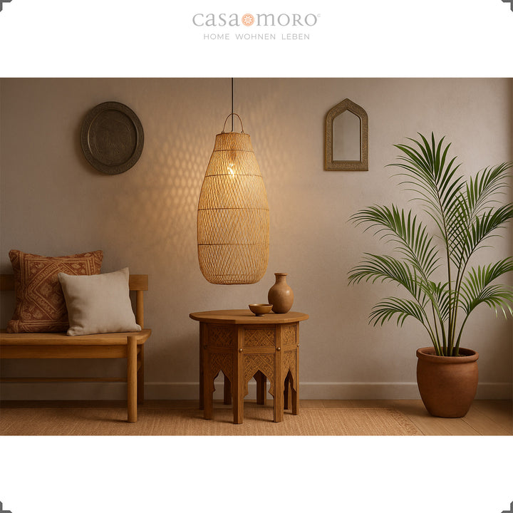 Large rattan lamp above oriental table in living room with warm and natural light