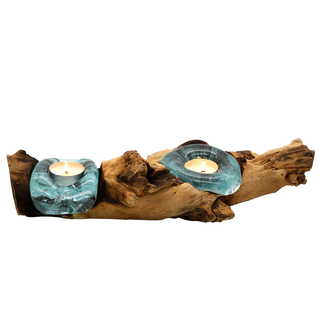 Elongated tea light holder with two glass shapes on natural root wood, whose warm candlelight creates gentle accents.