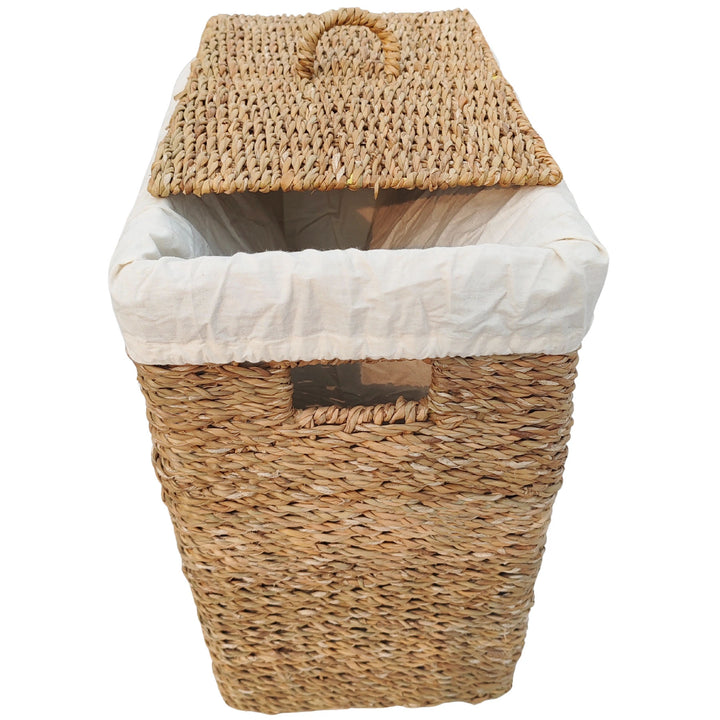 Rectangular laundry basket made of seagrass with a 50-liter capacity, a light-colored fabric insert, and a slanted lid.