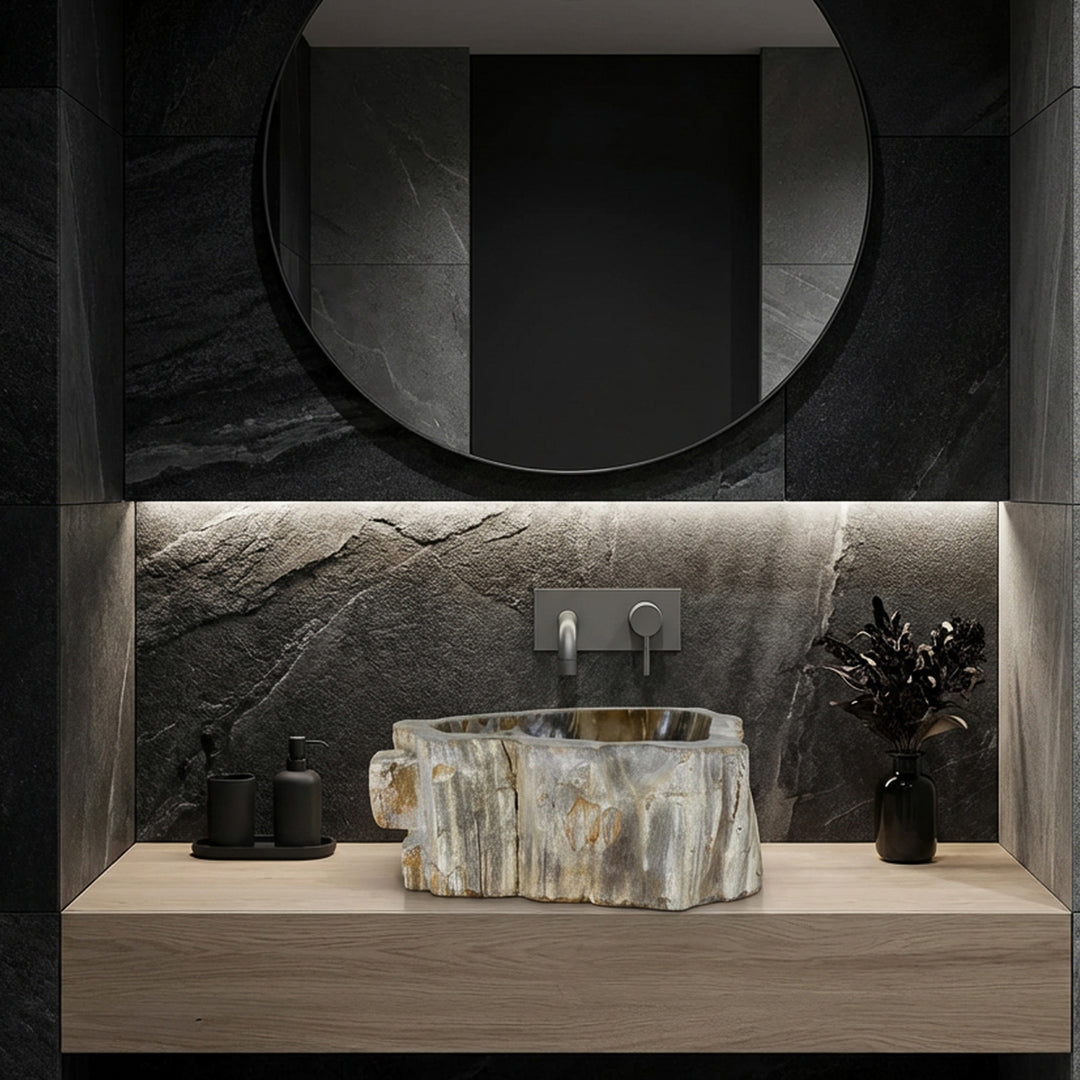Washbasin made of stone as a countertop washbasin, modern bathroom ambience with dark natural stone tiles, clear lines and subtle lighting.