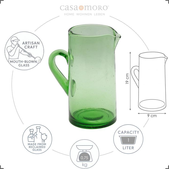 Green water carafe made of hand-blown glass with handle and spout